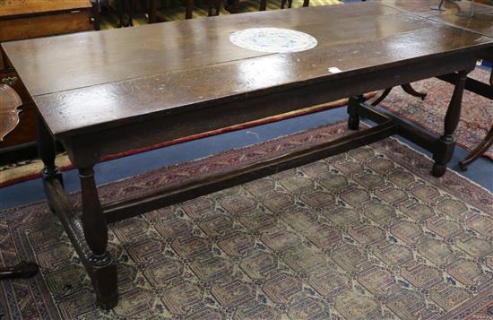 An 18th century style oak refectory table, W.196cm, D.86cm